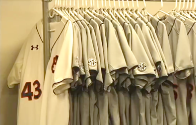 The newly washed Auburn Baseball jerseys line the wall in anticipation of opening day.